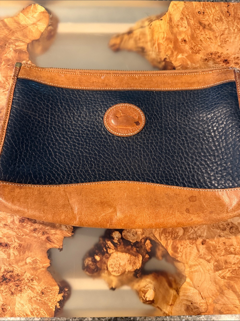 Dooney & Bourke Navy Pebbled Leather and Tan Trim Wristlet Clutch